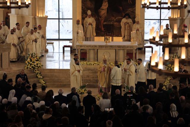 (260110) -- JORDAN RIVER, Jan. 10, 2026 (Xinhua) -- Christian Catholics attend an annual pilgrimage at the Baptism Site on the eastern bank of Jordan River, Jordan, Jan. 9, 2026. (Photo by Mohammad Abu Ghosh/Xinhua)