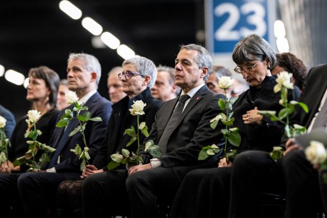 (260110) --  MARTIGNY, Jan. 10, 2026 (Xinhua) -- Swiss Foreign Minister Ignazio Cassis (2nd R) attends the official memorial ceremony mourning the victims of a New Year's Eve bar fire in Martigny, Switzerland, Jan. 9, 2026. Switzerland held a national memorial service on Friday to mourn the victims of a deadly New Year's Eve bar fire in the resort town of Crans-Montana, as authorities continued their investigation into the incident.
   Due to forecasts of heavy snowfall in Crans-Montana, Swiss authorities decided to hold the official ceremony in Martigny, more than 50 kilometers west of the resort town, citing safety concerns. (Photo by Louis Dasselborne/Xinhua)