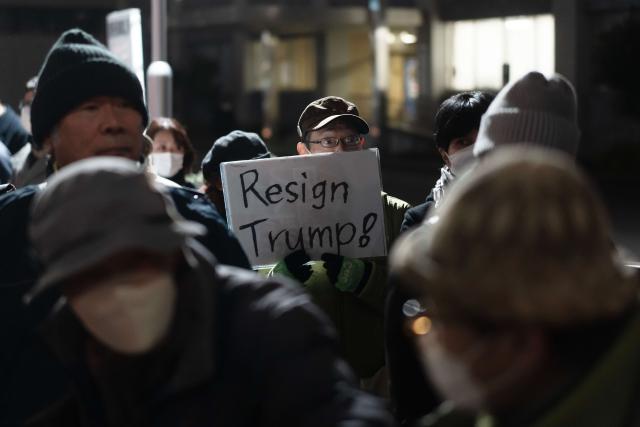 (260110) -- TOKYO, Jan. 10, 2026 (Xinhua) -- People attend a protest in front of the Japanese prime minister's official residence in Tokyo, Japan, on Jan. 9, 2026. Large numbers of Japanese residents rallied in Tokyo on Friday evening to protest Prime Minister Sanae Takaichi's evasive stance on U.S. military strikes against Venezuela, as well as a series of dangerous recent military policy moves by her administration. (Xinhua/Jia Haocheng)