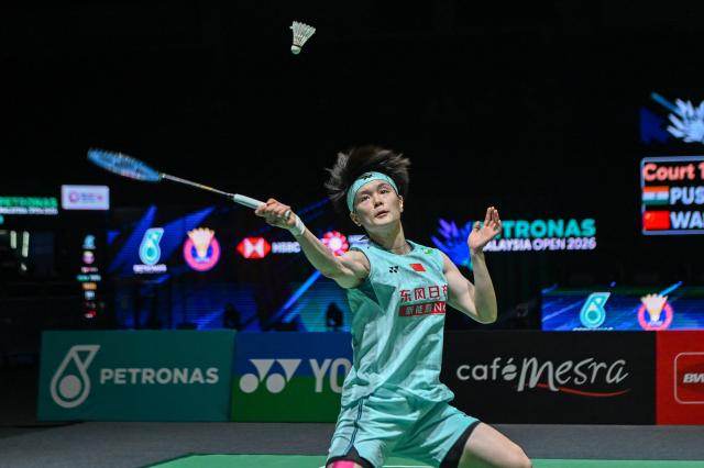 (260110) -- KUALA LUMPUR, Jan. 10, 2026 (Xinhua) -- Wang Zhiyi of China hits a return during the women's singles semifinal match against Pusarla V. Sindhu of India at the Malaysia Open 2026 badminton tournament in Kuala Lumpur, Malaysia, Jan. 10, 2026. (Photo by Chong Voon Chung/Xinhua)