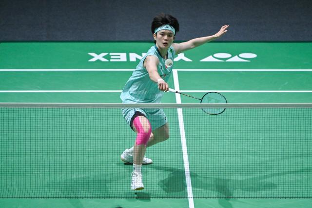 (260110) -- KUALA LUMPUR, Jan. 10, 2026 (Xinhua) -- Wang Zhiyi of China hits a return during the women's singles semifinal match against Pusarla V. Sindhu of India at the Malaysia Open 2026 badminton tournament in Kuala Lumpur, Malaysia, Jan. 10, 2026. (Photo by Chong Voon Chung/Xinhua)