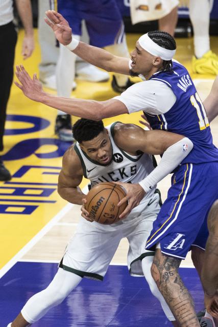 (260110) -- LOS ANGELES, Jan. 10, 2026 (Xinhua) -- Milwaukee Bucks' Giannis Antetokounmpo (L) drives the ball against Los Angeles Lakers' Jaxson Hayes during the 2025-2026 NBA regular season game between Los Angeles Lakers and Milwaukee Bucks in Los Angeles, the United States, Jan. 9, 2026. (Photo by Ringo Chiu/Xinhua)