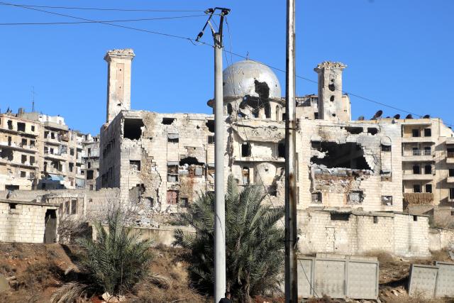 (260110) -- ALEPPO, Jan. 10, 2026 (Xinhua) -- Damaged buildings are seen in the Sheikh Maqsoud neighborhood in Aleppo, northern Syria, Jan. 10, 2026. The Syrian interim government on Friday accused the Kurdish-led Syrian Democratic Forces (SDF) of violating withdrawal arrangements in Aleppo and announced a military operation in the Sheikh Maqsoud neighborhood. (Str/Xinhua)
