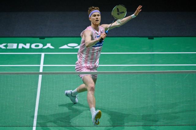 (260110) -- KUALA LUMPUR, Jan. 10, 2026 (Xinhua) -- Anders Antonsen of Denmark hits a return during the men's singles semifinal match against Shi Yuqi of China at the Malaysia Open 2026 badminton tournament in Kuala Lumpur, Malaysia, Jan. 10, 2026. (Photo by Chong Voon Chung/Xinhua)