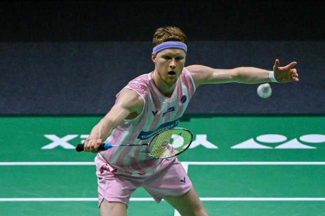 (260110) -- KUALA LUMPUR, Jan. 10, 2026 (Xinhua) -- Anders Antonsen of Denmark hits a return during the men's singles semifinal match against Shi Yuqi of China at the Malaysia Open 2026 badminton tournament in Kuala Lumpur, Malaysia, Jan. 10, 2026. (Photo by Chong Voon Chung/Xinhua)