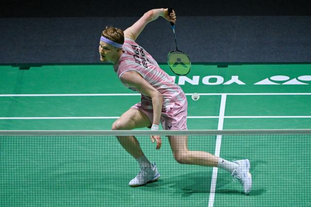 (260110) -- KUALA LUMPUR, Jan. 10, 2026 (Xinhua) -- Anders Antonsen of Denmark hits a return during the men's singles semifinal match against Shi Yuqi of China at the Malaysia Open 2026 badminton tournament in Kuala Lumpur, Malaysia, Jan. 10, 2026. (Photo by Chong Voon Chung/Xinhua)