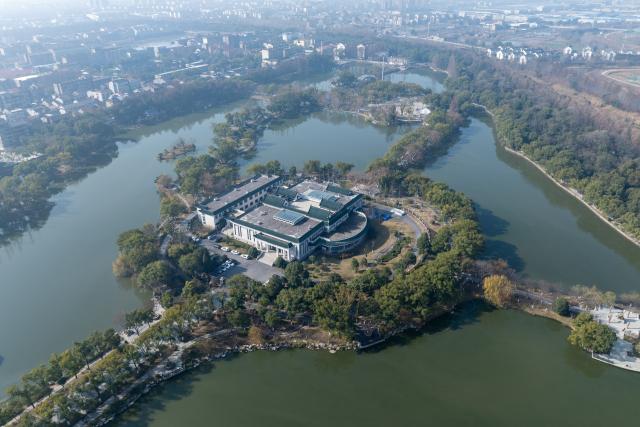 (260110) -- WUHAN, Jan. 10, 2026 (Xinhua) -- An aerial drone photo taken on Jan. 9, 2026 shows the cultural relics protection center in Jingzhou, central China's Hubei Province. Organic cultural relics represented by bamboo slips pose significant challenges in cultural relic preservation. In recent years, the cultural relics protection center in Jingzhou of Hubei Province has focused on innovation and application of preservation techniques for organic cultural relics, striving to ensure comprehensive care for such items. (Xinhua/Du Zixuan)