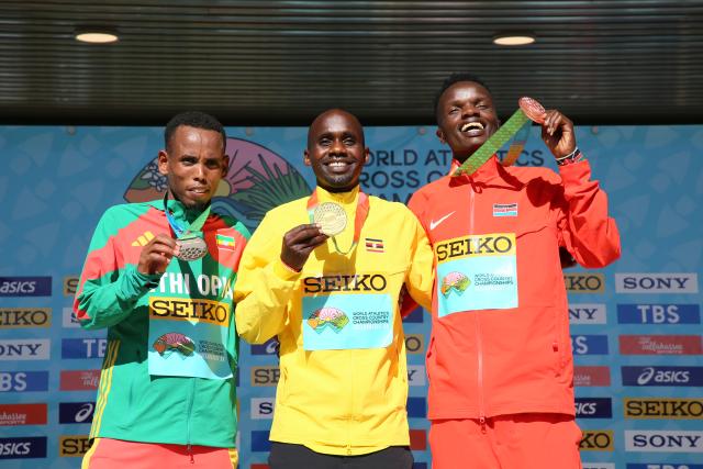 (260111) -- TALLAHASSEE, Jan. 11, 2026 (Xinhua) -- Gold medalist Uganda's Jacob Kiplimo (C), silver medalist Ethiopia's Berihu Aregawi (L) and bronze medalist Kenya's Daniel Simiu Ebenyo celebrate during the awarding ceremony for the Senior Men's Race at the World Athletics Cross Country Championships 2026 in Tallahassee, Florida, the United States, on Jan. 10, 2026. (Xinhua/Zhang Fengguo)