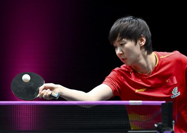 (260111) -- DOHA, Jan. 11, 2026 (Xinhua) -- Wang Manyu of China hits a return during the women's singles quarter-final match against Han Ying of Germany at the WTT Champions Doha 2026 in Doha, Qatar, on Jan. 10, 2026. (Photo by Nikku/Xinhua)