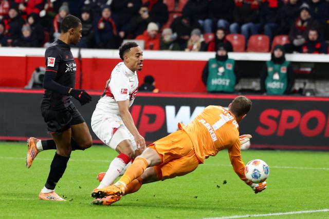 (260111) -- LEVERKUSEN, Jan. 11, 2026 (Xinhua) -- Mark Flekken (R), goalkeeper of Bayer 04 Leverkusen, makes a save during the German first division of Bundesliga football match between Bayer 04 Leverkusen and VfB Stuttgart in Leverkusen, Germany, Jan. 10, 2026. (Photo by Joachim Bywaletz/Xinhua)