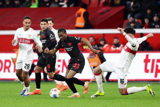 (260111) -- LEVERKUSEN, Jan. 11, 2026 (Xinhua) -- Nathan Tella (2nd R) of Bayer 04 Leverkusen vies with Atakan Karazor (1st R) of VfB Stuttgart during the German first division of Bundesliga football match between Bayer 04 Leverkusen and VfB Stuttgart in Leverkusen, Germany, Jan. 10, 2026. (Photo by Joachim Bywaletz/Xinhua)
