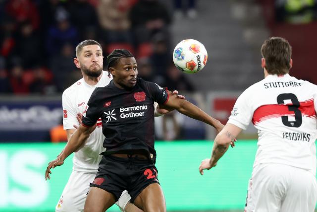 (260111) -- LEVERKUSEN, Jan. 11, 2026 (Xinhua) -- Nathan Tella (C) of Bayer 04 Leverkusen vies with Josha Vagnoman (L) of VfB Stuttgart during the German first division of Bundesliga football match between Bayer 04 Leverkusen and VfB Stuttgart in Leverkusen, Germany, Jan. 10, 2026. (Photo by Joachim Bywaletz/Xinhua)