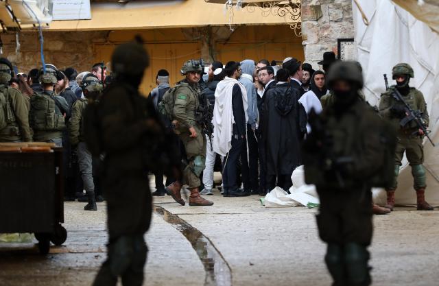 (260111) -- HEBRON, Jan. 11, 2026 (Xinhua) -- Members of Israeli forces secure the streets for Israeli settlers in the West Bank city of Hebron on Jan. 10, 2026. (Photo by Mamoun Wazwaz/Xinhua)
