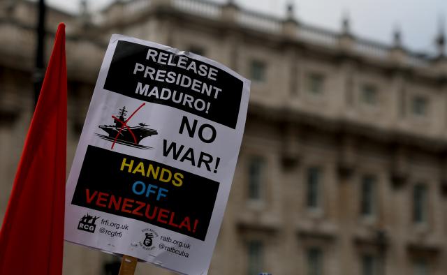 (260111) -- LONDON, Jan. 11, 2026 (Xinhua) -- A placard is seen during a protest condemning U.S. attack on Venezuela outside No. 10 Downing Street in London, Britain, Jan. 10, 2026. (Xinhua/Li Ying)