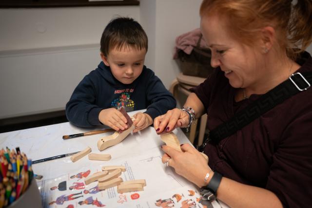 (260111) -- PRAGUE, Jan. 11, 2026 (Xinhua) -- A child and a parent make a puppet at the Museum of Prague in Prague, the Czech Republic, Jan. 10, 2026. The Museum of Prague hosted a family-oriented event on Saturday, featuring a puppet show about a garbage collector's work and hands-on puppet-making activities, promoting reuse and sustainable practices. (Photo by Dana Kesnerova/Xinhua)