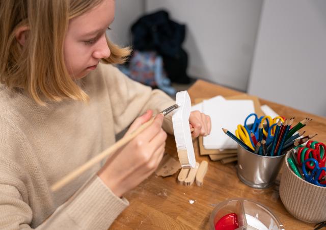 (260111) -- PRAGUE, Jan. 11, 2026 (Xinhua) -- A child makes a puppet at the Museum of Prague in Prague, the Czech Republic, Jan. 10, 2026. The Museum of Prague hosted a family-oriented event on Saturday, featuring a puppet show about a garbage collector's work and hands-on puppet-making activities, promoting reuse and sustainable practices. (Photo by Dana Kesnerova/Xinhua)