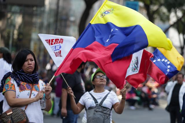 (260111) -- MEXICO CITY, Jan. 11, 2026 (Xinhua) -- People attend a protest condemning U.S. attack on Venezuela in Mexico City, Mexico, Jan. 10, 2026. (Photo by Francisco Canedo/Xinhua)