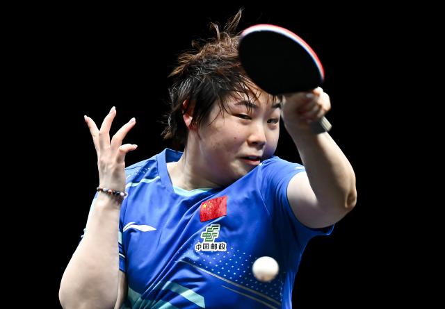 (260111) -- DOHA, Jan. 11, 2026 (Xinhua) -- Kuai Man of China hits a return during the women's singles quarter-final match against Nagasaki Miyu of Japan at the WTT Champions Doha 2026 in Doha, Qatar, on Jan. 10, 2026. (Photo by Nikku/Xinhua)