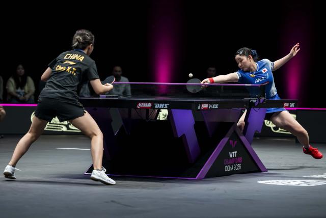 (260111) -- DOHA, Jan. 11, 2026 (Xinhua) -- Harimoto Miwa (R) of Japan hits a return during the women's singles quarter-final match against Chen Xingtong of China at the WTT Champions Doha 2026 in Doha, Qatar, on Jan. 10, 2026. (Photo by Nikku/Xinhua)