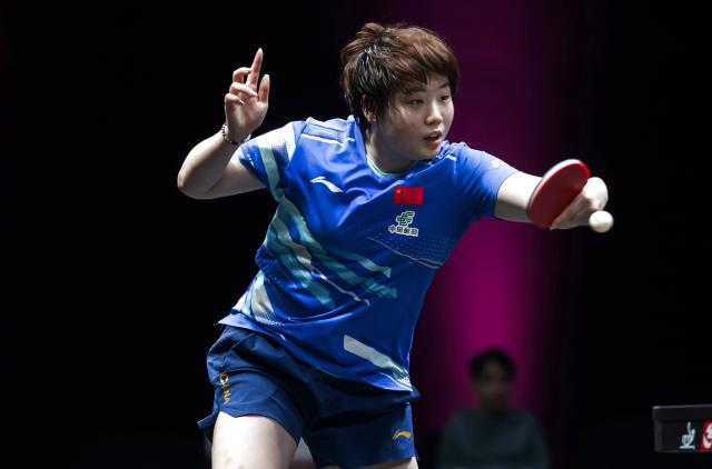 (260111) -- DOHA, Jan. 11, 2026 (Xinhua) -- Kuai Man of China hits a return during the women's singles quarter-final match against Nagasaki Miyu of Japan at the WTT Champions Doha 2026 in Doha, Qatar, on Jan. 10, 2026. (Photo by Nikku/Xinhua)