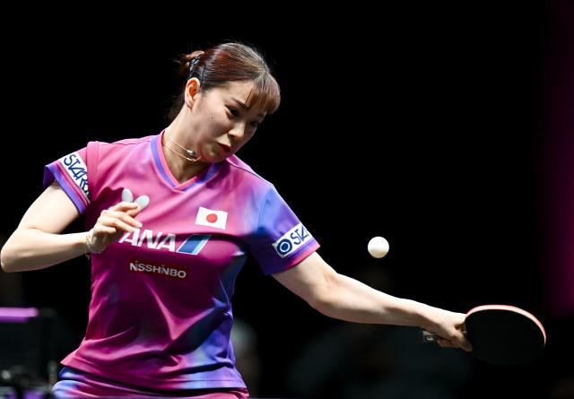 (260111) -- DOHA, Jan. 11, 2026 (Xinhua) -- Nagasaki Miyu of Japan hits a return during the women's singles quarter-final match against Kuai Man of China at the WTT Champions Doha 2026 in Doha, Qatar, on Jan. 10, 2026. (Photo by Nikku/Xinhua)