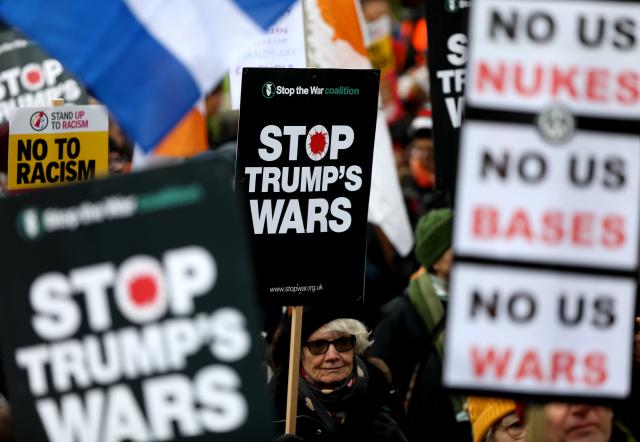 (260111) -- BEIJING, Jan. 11, 2026 (Xinhua) -- Demonstrators hold placards during a protest condemning U.S. attack on Venezuela outside No. 10 Downing Street in London, Britain, Jan. 10, 2026. (Xinhua/Li Ying)