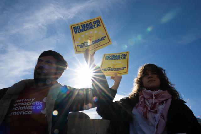 (260111) -- SAN FRANCISCO, Jan. 11, 2026 (Xinhua) -- People attend a protest in San Francisco, California, the United States, on Jan. 10, 2026. People gathered here to protest against the U.S. attack on Venezuela, as well as a fatal shooting of a 37-year-old woman by an Immigration and Customs Enforcement agent in Minnesota on Jan. 7. (Photo by Ziyu Julian Zhu/Xinhua)