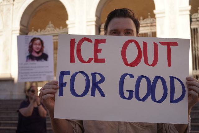 (260111) -- LOS ANGELES, Jan. 11, 2026 (Xinhua) -- A protester holding a placard participates in a protest against the Immigration and Customs Enforcement (ICE) in Pasadena, Los Angeles County, California, the United States, on Jan. 10, 2026. TO GO WITH "Dozens of protests against ICE held across U.S. California" (Xinhua)