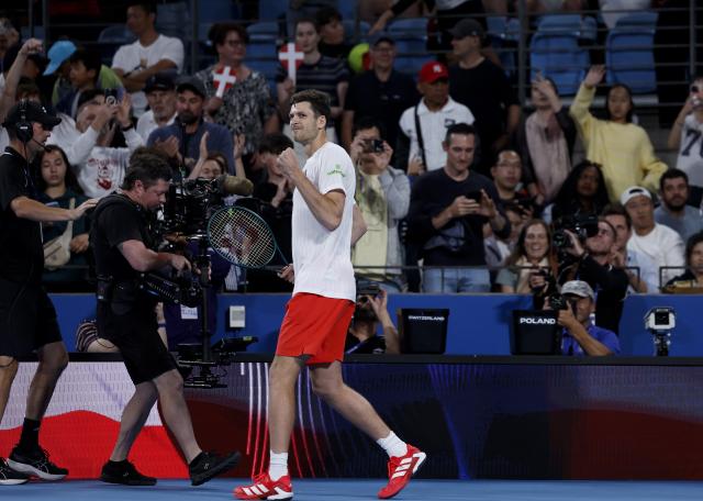 (260111) -- SYDNEY, Jan. 11, 2026 (Xinhua) -- Hubert Hurkacz of Team Poland celebrates winning the men's singles match against Stan Wawrinka of Team Switzerland at the 2026 United Cup tennis tournament final in Sydney, Australia, Jan. 11, 2026. (Xinhua/Ma Ping)