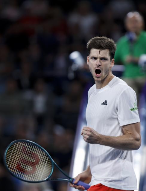 (260111) -- SYDNEY, Jan. 11, 2026 (Xinhua) -- Hubert Hurkacz of Team Poland celebrates during the men's singles match against Stan Wawrinka of Team Switzerland at the 2026 United Cup tennis tournament final in Sydney, Australia, Jan. 11, 2026. (Xinhua/Ma Ping)