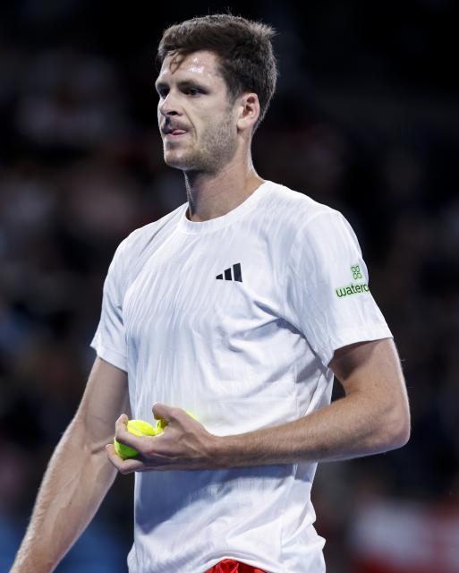 (260111) -- SYDNEY, Jan. 11, 2026 (Xinhua) -- Hubert Hurkacz of Team Poland reacts during the men's singles match against Stan Wawrinka of Team Switzerland at the 2026 United Cup tennis tournament final in Sydney, Australia, Jan. 11, 2026. (Xinhua/Ma Ping)