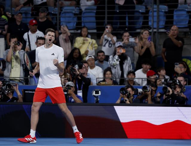 (260111) -- SYDNEY, Jan. 11, 2026 (Xinhua) -- Hubert Hurkacz of Team Poland celebrates winning the men's singles match against Stan Wawrinka of Team Switzerland at the 2026 United Cup tennis tournament final in Sydney, Australia, Jan. 11, 2026. (Xinhua/Ma Ping)