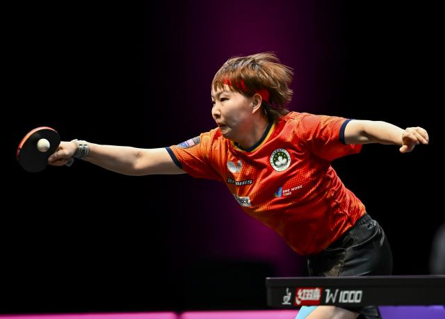 (260111) -- DOHA, Jan. 11, 2026 (Xinhua) -- Zhu Yuling of China's Macao hits a return during the women's singles semifinal match against Han Ying of Germany at the WTT Champions Doha 2026 in Doha, Qatar, Jan. 11, 2026. (Photo by Nikku/Xinhua)