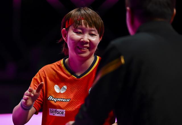 (260111) -- DOHA, Jan. 11, 2026 (Xinhua) -- Zhu Yuling (L) of China's Macao reacts after the women's singles semifinal match against Han Ying of Germany at the WTT Champions Doha 2026 in Doha, Qatar, Jan. 11, 2026. (Photo by Nikku/Xinhua)