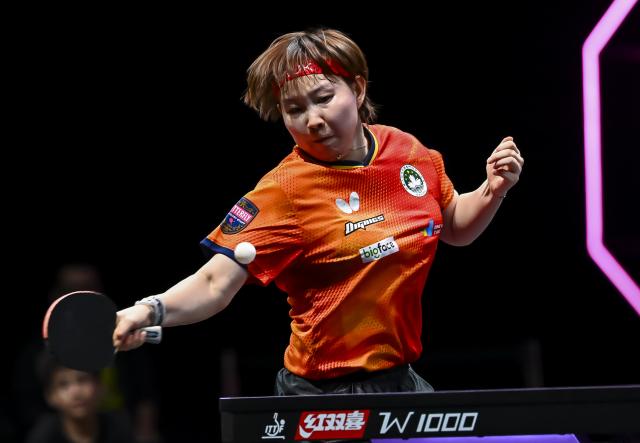 (260111) -- DOHA, Jan. 11, 2026 (Xinhua) -- Zhu Yuling of China's Macao hits a return during the women's singles semifinal match against Han Ying of Germany at the WTT Champions Doha 2026 in Doha, Qatar, Jan. 11, 2026. (Photo by Nikku/Xinhua)