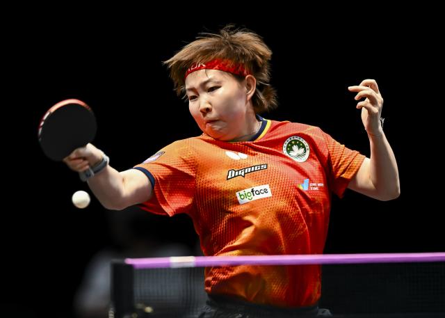 (260111) -- DOHA, Jan. 11, 2026 (Xinhua) -- Zhu Yuling of China's Macao hits a return during the women's singles semifinal match against Han Ying of Germany at the WTT Champions Doha 2026 in Doha, Qatar, Jan. 11, 2026. (Photo by Nikku/Xinhua)
