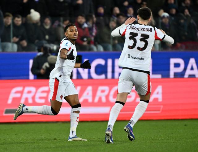 (260112) -- FLORENCE, Jan. 12, 2026 (Xinhua) -- AC Milan's Christopher Nkunku (L) celebrates his goal with teammate Davide Bartesaghi during a Serie A football match between Fiorentina and AC Milan in Florence, Italy, Jan. 11, 2026. (Photo by Alberto Lingria/Xinhua)