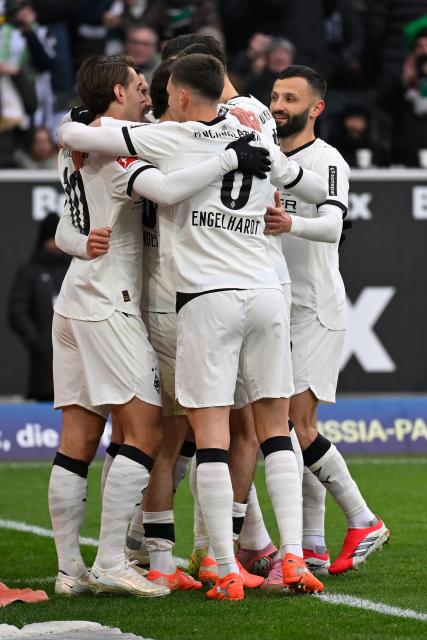 (260112) -- MOENCHENGLADBACH, Jan. 12, 2026 (Xinhua) -- Players of Borussia Moenchengladbach celebrate scoring during the German first division of Bundesliga football match between Borussia Moenchengladbach and FC Augsburg in Moenchengladbach, Germany, Jan. 11, 2026. (Photo by Ulrich Hufnagel/Xinhua)
