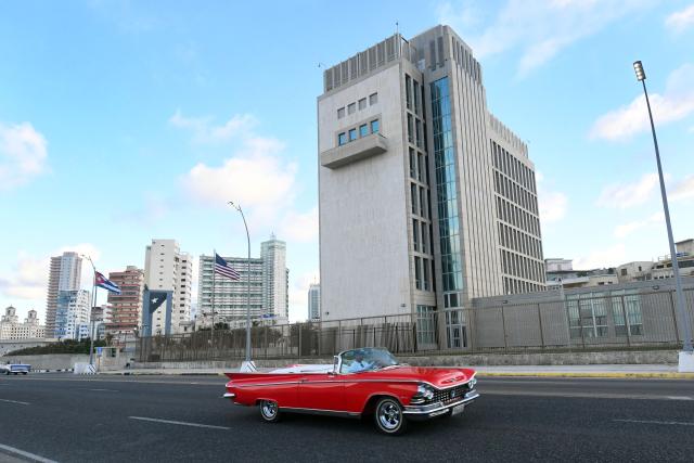 (260112) -- HAVANA, Jan. 12, 2026 (Xinhua) -- A vintage car drives along an avenue in front of the U.S. Embassy, in Havana, capital of Cuba, on Jan. 11, 2026. Cuban President Miguel Diaz-Canel on Sunday said Cuba is a free, independent and sovereign nation, rejecting U.S. President Donald Trump's accusations that the island country provided "security services" to Venezuela in exchange for oil. (Photo by Joaquin Hernandez/Xinhua)