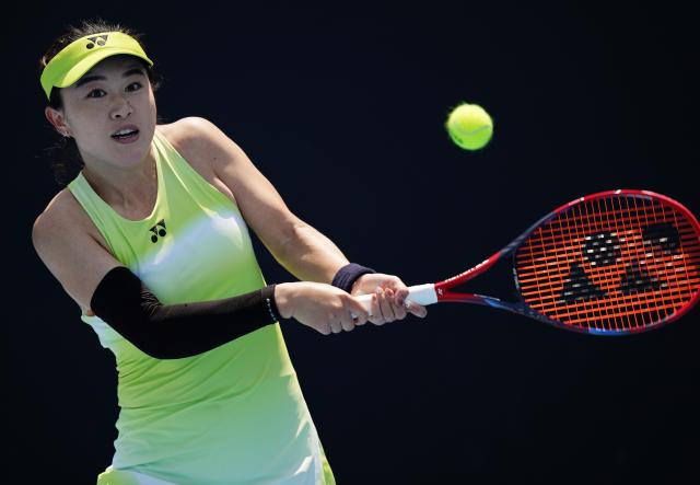 (260112) -- MELBOURNE, Jan. 12, 2026 (Xinhua) -- Zhu Lin of China hits a return during the women's singles qualifying 1st round match against Laura Pigossi of Brazil at Australian Open tennis tournament in Melbourne, Australia, Jan. 12, 2026. (Xinhua/Wang Shen)