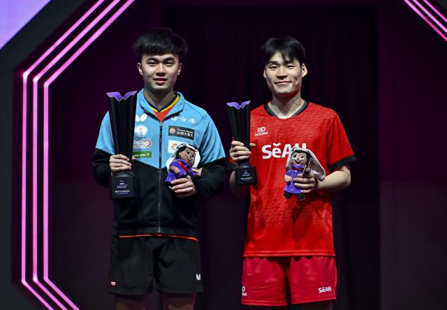 (260112) -- DOHA, Jan. 12, 2026 (Xinhua) -- Gold medalist Lin Yun-Ju (L) of Chinese Taipei and silver medalist Jang Woojin of South Korea pose on the podium after their men's singles final match at the WTT Champions Doha 2026 in Doha, Qatar, Jan. 11, 2026. (Photo by Nikku/Xinhua)
