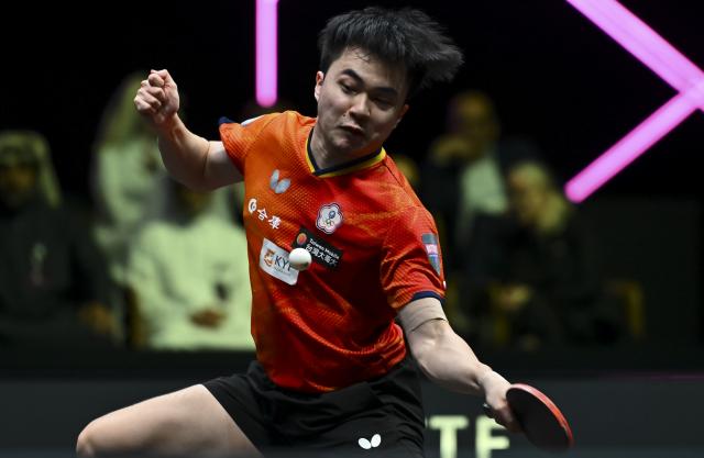 (260112) -- DOHA, Jan. 12, 2026 (Xinhua) -- Lin Yun-Ju of Chinese Taipei hits a return during the men's singles final match against Jang Woojin of South Korea at the WTT Champions Doha 2026 in Doha, Qatar, Jan. 11, 2026. (Photo by Nikku/Xinhua)