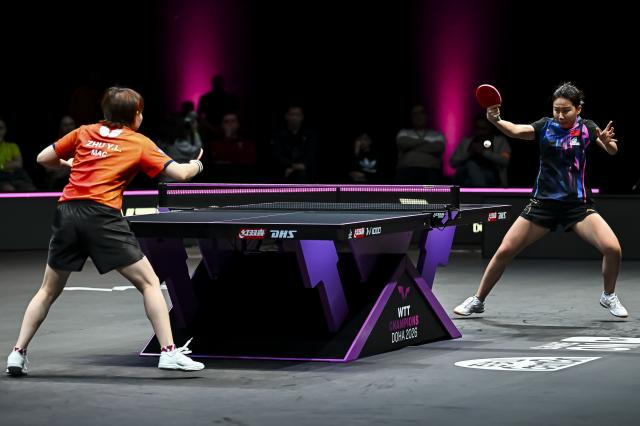 (260112) -- DOHA, Jan. 12, 2026 (Xinhua) -- Chen Xingtong (R) of China hits a return during the women's singles final match against Zhu Yuling of China's Macao at the WTT Champions Doha 2026 in Doha, Qatar, on Jan. 11, 2026. (Photo by Nikku/Xinhua)