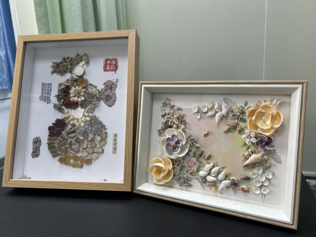 (260112) -- BEIJING, Jan. 12, 2026 (Xinhua) -- This photo taken on Jan. 7, 2026 shows collages created by senior patients during group cognitive training sessions at the memory clinic of Hepingli Community Health Service Center in Beijing, capital of China. TO GO WITH "China Focus: Community memory clinics help aging minds stay connected" (Xinhua/Shen Anni)