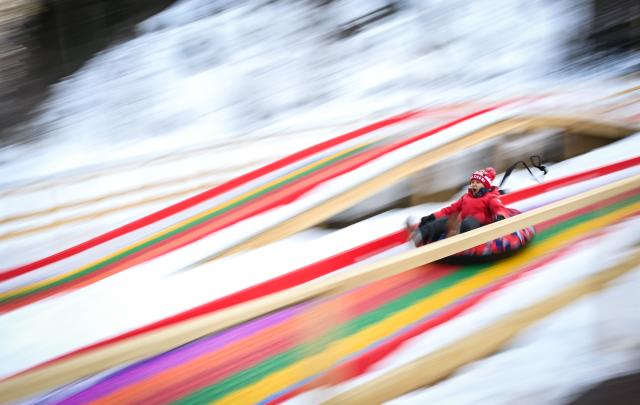 (260112) -- ALMATY, Jan. 12, 2026 (Xinhua) -- A child enjoys ice slide on the outskirts of Almaty, Kazakhstan, on Jan. 11, 2026. (Xinhua/Li Renzi)