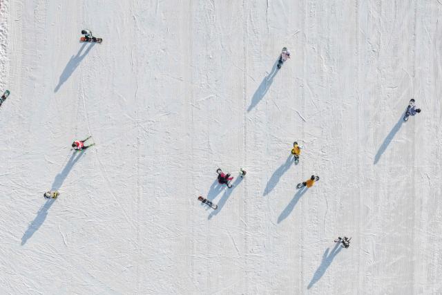 (260112) -- HOHHOT, Jan. 12, 2026 (Xinhua) -- An aerial drone photo taken on Dec. 14, 2025 shows people skiing at a skiing resort in Hohhot, north China's Inner Mongolia Autonomous Region. Hohhot has launched more than 300 winter amusement programs since December 2025, incorporating ice and snow sports, cultural experiences and vogue consumption to boost the local economy. (Xinhua/Li Zhipeng)