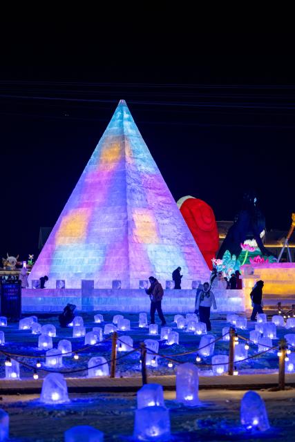 (260112) -- HOHHOT, Jan. 12, 2026 (Xinhua) -- This photo taken on Dec. 31, 2025 shows people attending an ice and snow festival in Hohhot, north China's Inner Mongolia Autonomous Region. Hohhot has launched more than 300 winter amusement programs since December 2025, incorporating ice and snow sports, cultural experiences and vogue consumption to boost the local economy. (Xinhua/Lian Zhen)