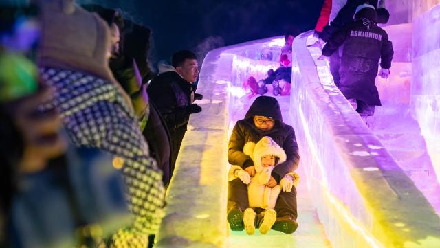 (260112) -- HOHHOT, Jan. 12, 2026 (Xinhua) -- This photo taken on Dec. 31, 2025 shows people attending an ice and snow festival in Hohhot, north China's Inner Mongolia Autonomous Region. Hohhot has launched more than 300 winter amusement programs since December 2025, incorporating ice and snow sports, cultural experiences and vogue consumption to boost the local economy. (Photo by Xu Ting/Xinhua)