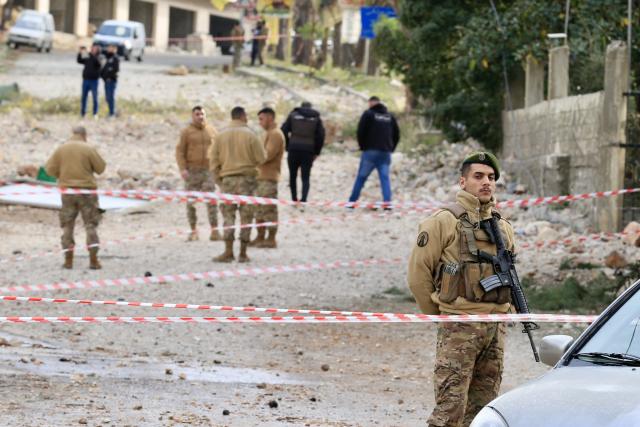 (260112) -- KFAR HATTA, Jan. 12, 2026 (Xinhua) -- A Lebanese soldier (1st R) inspects damage to residential buildings and cars following Israeli airstrikes in Kfar Hatta, southern Lebanon, Jan. 12, 2026. The Israeli forces carried out on Sunday afternoon airstrikes on the village of Kfar Hatta in southern Lebanon's Litani River area, Lebanon's official National News Agency (NNA) reported.
   A Lebanese security source told Xinhua that Israeli warplanes carried out more than 35 airstrikes in three waves, firing around 70 missiles at Hezbollah positions and residential buildings in Kfar Hatta. The strikes caused extensive destruction, damaging dozens of homes. (Photo by Ali Hashisho/Xinhua)