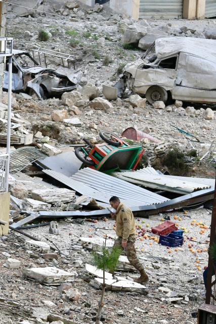 (260112) -- KFAR HATTA, Jan. 12, 2026 (Xinhua) -- A Lebanese soldier inspects damage to residential buildings and cars following Israeli airstrikes in Kfar Hatta, southern Lebanon, Jan. 12, 2026. The Israeli forces carried out on Sunday afternoon airstrikes on the village of Kfar Hatta in southern Lebanon's Litani River area, Lebanon's official National News Agency (NNA) reported.
   A Lebanese security source told Xinhua that Israeli warplanes carried out more than 35 airstrikes in three waves, firing around 70 missiles at Hezbollah positions and residential buildings in Kfar Hatta. The strikes caused extensive destruction, damaging dozens of homes. (Photo by Ali Hashisho/Xinhua)